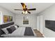 Staged bedroom with grey walls, wood flooring, ceiling fan, and decor for a home-like feeling at 430 Argus Nw Cir, Atlanta, GA 30331
