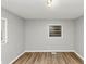A bright bedroom featuring light-colored walls, wood-look flooring, and natural light at 430 Argus Nw Cir, Atlanta, GA 30331