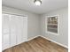 Bedroom featuring modern vinyl floors, a window, and a closet at 430 Argus Nw Cir, Atlanta, GA 30331