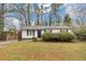 Charming single-story home with well-kept lawn, mature trees and traditional curb appeal at 430 Argus Nw Cir, Atlanta, GA 30331