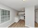 Bright kitchen featuring white cabinets, new countertops, and wood-look floors at 430 Argus Nw Cir, Atlanta, GA 30331