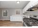 Updated kitchen with stainless appliances, white cabinets, and ample counter space at 430 Argus Nw Cir, Atlanta, GA 30331