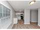 Modern kitchen with updated appliances, white cabinets, and wood-look flooring at 430 Argus Nw Cir, Atlanta, GA 30331