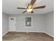 Bright living room featuring ceiling fan and updated wood-look floors throughout at 430 Argus Nw Cir, Atlanta, GA 30331