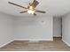 Bright and airy living room with a modern ceiling fan and wood-look floors at 430 Argus Nw Cir, Atlanta, GA 30331