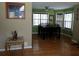 Bright dining room featuring hardwood floors, a modern ceiling fan, and large windows for ample natural light at 22 Briar Chase Ct, White, GA 30184