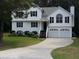 Charming two-story home with a well-manicured lawn, attached two-car garage, and inviting curb appeal at 22 Briar Chase Ct, White, GA 30184