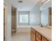 Bright bathroom features a tub, shower, and vanity with abundant storage space at 229 Millwheel Dr, Villa Rica, GA 30180