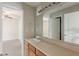 Bathroom vanity with a large mirror and a connecting door to the bedroom at 229 Millwheel Dr, Villa Rica, GA 30180