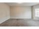 Bedroom with neutral paint and carpet offers a blank canvas for personalization at 229 Millwheel Dr, Villa Rica, GA 30180