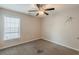 Bedroom with ceiling fan, carpeting and a window at 229 Millwheel Dr, Villa Rica, GA 30180