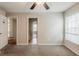 Neutral bedroom with carpet, ceiling fan, and bright window, showcasing a calm and inviting space at 229 Millwheel Dr, Villa Rica, GA 30180
