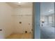 Simple laundry room featuring tile floors, white walls, and wire shelving at 229 Millwheel Dr, Villa Rica, GA 30180