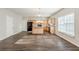 Open-concept kitchen and living room with wood-look floors and bright, natural lighting at 229 Millwheel Dr, Villa Rica, GA 30180