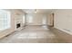 Bright living room with a fireplace and neutral carpet adjacent to the rear door at 229 Millwheel Dr, Villa Rica, GA 30180