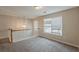 Upstairs loft features neutral walls and carpet, as well as a window at 229 Millwheel Dr, Villa Rica, GA 30180