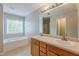 Bright primary bathroom features dual sinks, a tub, and a large vanity at 229 Millwheel Dr, Villa Rica, GA 30180
