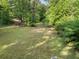 Large backyard with mature trees at 601 Ashley Forest Nw Dr, Acworth, GA 30102