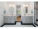 Elegant bathroom featuring dual vanities, a walk-in shower, and stylish fixtures at 601 Ashley Forest Nw Dr, Acworth, GA 30102