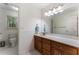 Bathroom featuring a wood vanity, tile floors, and plenty of natural light at 601 Ashley Forest Nw Dr, Acworth, GA 30102