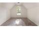Bright bedroom featuring a large arched window and neutral carpet at 601 Ashley Forest Nw Dr, Acworth, GA 30102
