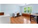 Bedroom showcasing beautiful wood floors and a bright window view at 601 Ashley Forest Nw Dr, Acworth, GA 30102
