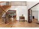 Elegant foyer with hardwood floors, staircase, and detailed trim at 601 Ashley Forest Nw Dr, Acworth, GA 30102