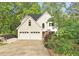 Charming home featuring a two-car garage and beautiful landscaping at 601 Ashley Forest Nw Dr, Acworth, GA 30102