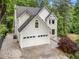 Elegant home featuring a spacious garage and attractive landscaping at 601 Ashley Forest Nw Dr, Acworth, GA 30102