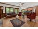 Open living room with fireplace, hardwood floors, comfortable furniture, and seamlessly connected to kitchen at 601 Ashley Forest Nw Dr, Acworth, GA 30102