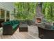 Inviting outdoor space with a stone fireplace and comfortable seating area at 601 Ashley Forest Nw Dr, Acworth, GA 30102