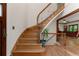 Sweeping staircase with wood and wrought iron and hardwood floors at 601 Ashley Forest Nw Dr, Acworth, GA 30102