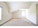 Bright attic area with neutral carpet, trim, and natural light at 1143 Park Hollow Ne Ln, Lawrenceville, GA 30043