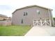 A well-maintained backyard, showcasing a spacious lawn and a two-car garage at 1143 Park Hollow Ne Ln, Lawrenceville, GA 30043