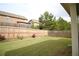 Green backyard featuring a wooden fence and well-maintained grass at 1143 Park Hollow Ne Ln, Lawrenceville, GA 30043