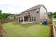 A spacious backyard with a covered patio, perfect for entertaining or relaxing outdoors at 1143 Park Hollow Ne Ln, Lawrenceville, GA 30043