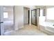 Luxurious bathroom featuring a glass enclosed shower, soaking tub, and tile flooring at 1143 Park Hollow Ne Ln, Lawrenceville, GA 30043