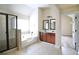 Elegant bathroom features a soaking tub, a glass shower, dual sinks and vanity at 1143 Park Hollow Ne Ln, Lawrenceville, GA 30043