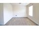 Cozy bedroom with plush carpeting and a bright window at 1143 Park Hollow Ne Ln, Lawrenceville, GA 30043