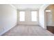 Cozy bedroom with neutral walls and carpeted floors at 1143 Park Hollow Ne Ln, Lawrenceville, GA 30043