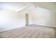 Neutral bedroom featuring carpet, white trim, and a nearby doorway at 1143 Park Hollow Ne Ln, Lawrenceville, GA 30043