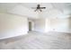 Large bedroom boasts a ceiling fan, plush carpeting, and access to an ensuite bathroom at 1143 Park Hollow Ne Ln, Lawrenceville, GA 30043
