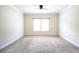 Spacious bedroom featuring neutral carpet, trim, and a ceiling fan at 1143 Park Hollow Ne Ln, Lawrenceville, GA 30043