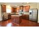 Well-lit kitchen features stainless steel appliances, granite countertops, and a center island at 1143 Park Hollow Ne Ln, Lawrenceville, GA 30043
