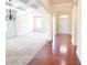 Spacious living room boasts hardwood floors, and stylish chandelier at 1143 Park Hollow Ne Ln, Lawrenceville, GA 30043