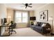 Comfortable living room featuring modern furniture, a ceiling fan, and a well-lit window at 1143 Park Hollow Ne Ln, Lawrenceville, GA 30043