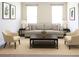Comfortable living room setup with neutral tones, featuring modern furniture, decor, and plush carpeting at 1143 Park Hollow Ne Ln, Lawrenceville, GA 30043