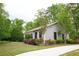 Charming pool house surrounded by beautiful landscaping and lush greenery at 1143 Park Hollow Ne Ln, Lawrenceville, GA 30043