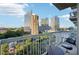 City view from balcony with metal railing and table with chairs at 3324 Peachtree Ne Rd # 1104, Atlanta, GA 30326