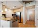 Well-lit kitchen featuring stainless steel appliances, sleek countertops, and stylish lighting fixtures at 3324 Peachtree Ne Rd # 1104, Atlanta, GA 30326